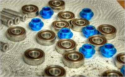 Inline skate bearings, axles and spacers