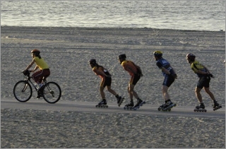 Skaters sharing trail with bike rider